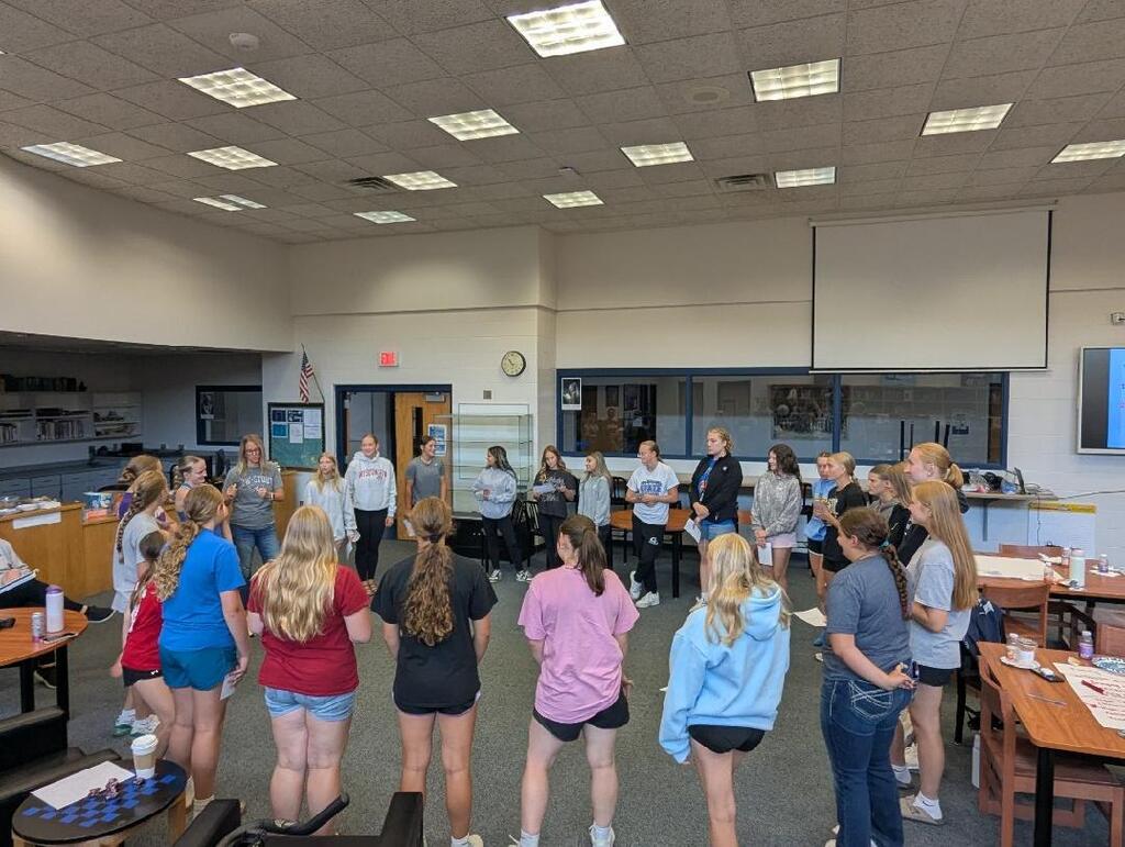 girls standing in a circle