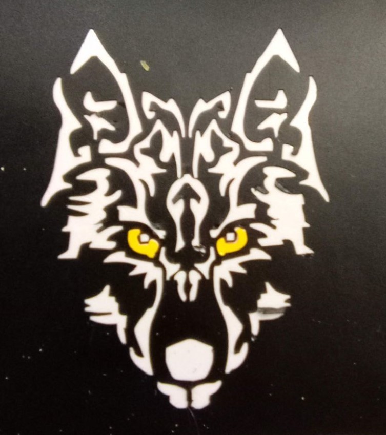 Alt text: “A stylized vinyl decal of a wolf’s face on a black background. The design features sharp, geometric white lines with striking yellow eyes, creating a bold and intense appearance.”