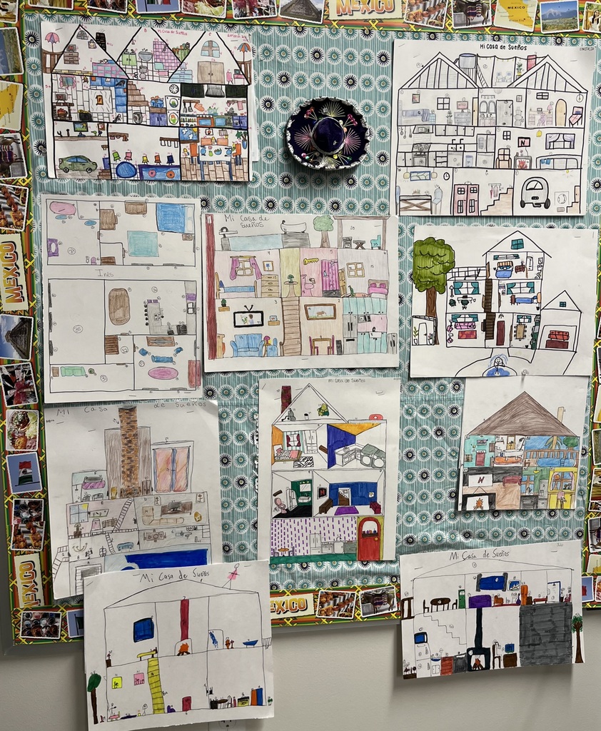 Bulletinboard with pictures fo houses in many different colors