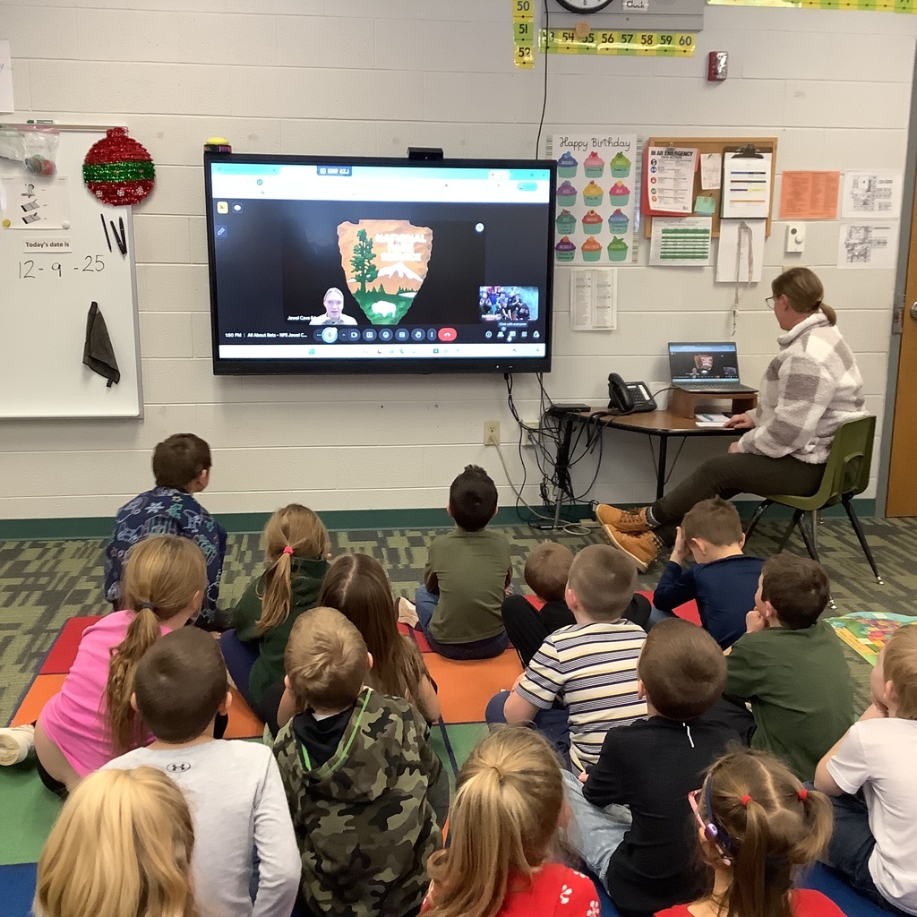Florence 1st Graders watch a virtual field trip on a smartboard