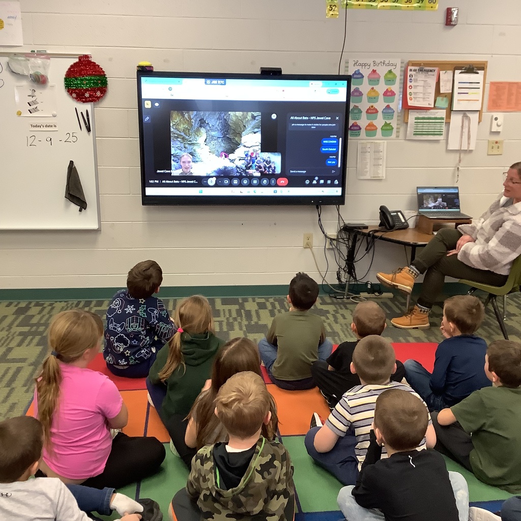 Florence 1st Graders watch a virtual field trip on a smartboard