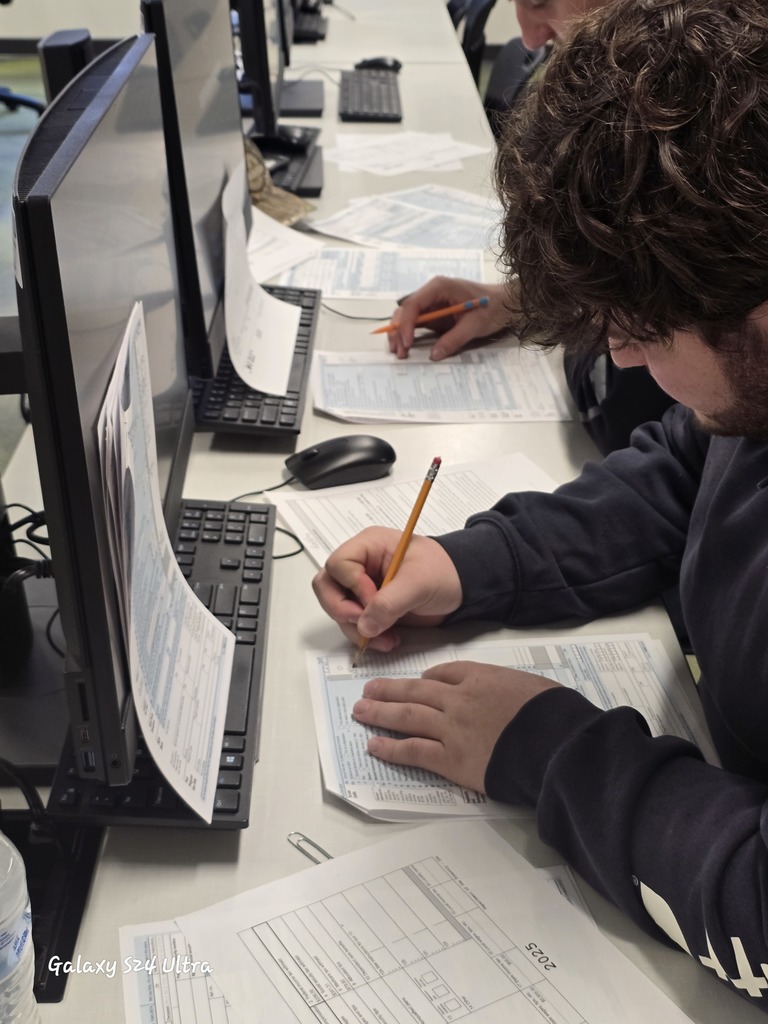 Florence Business Ed Students with tax return forms