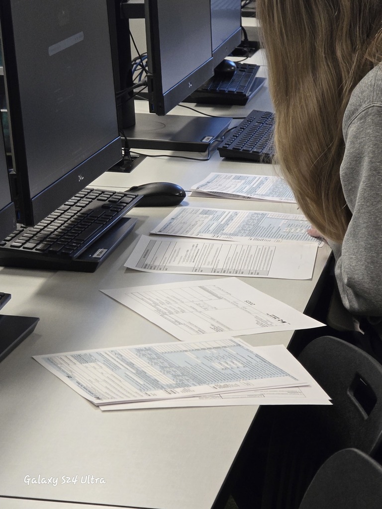 Florence Business Ed Students with tax return forms