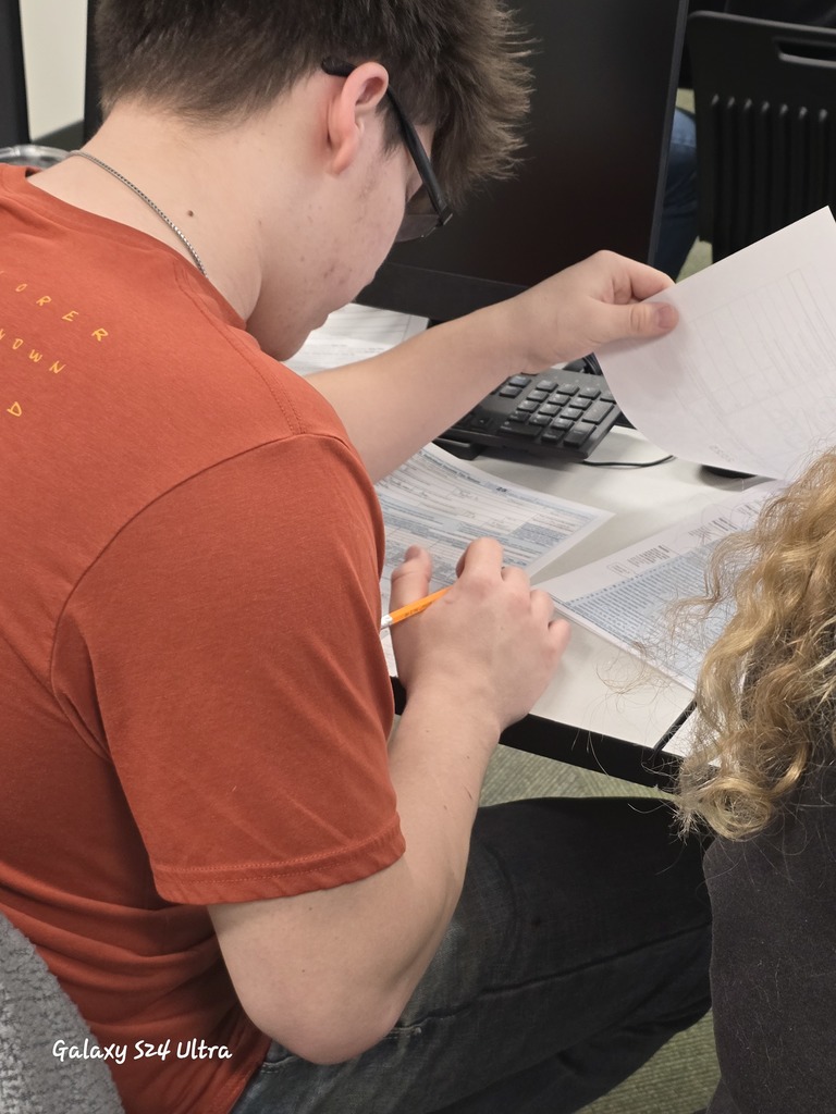 Florence Business Ed Students with tax return forms