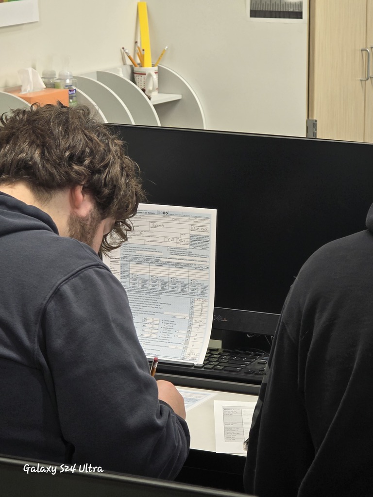 Florence Business Ed Students with tax return forms