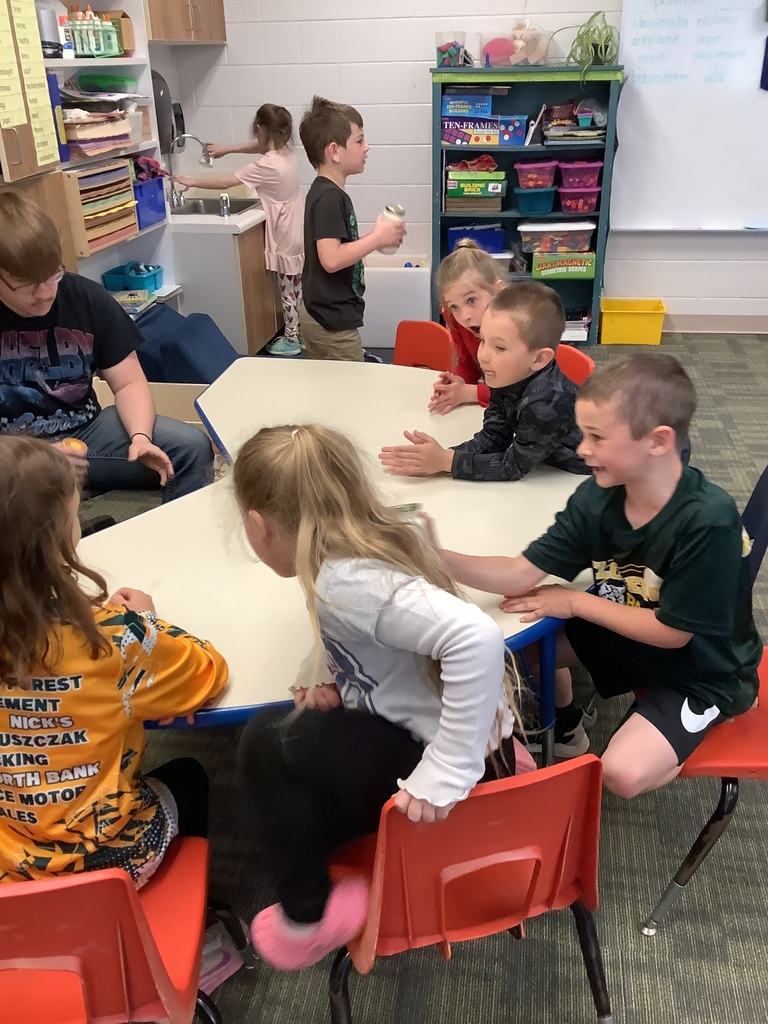 1st grade students making butter