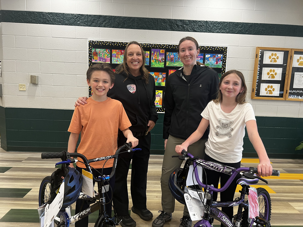 Teresa Chrisman and Florence Health Department Representative with students and bikes