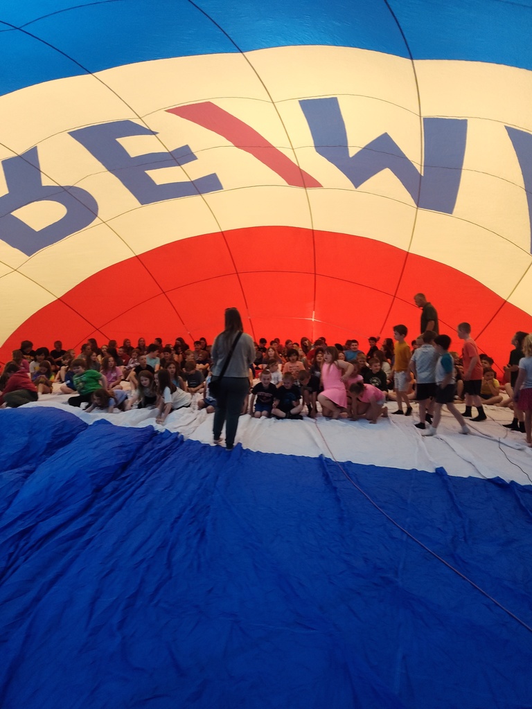 Kid sitting in Remax hot air balloon in Florence Gym