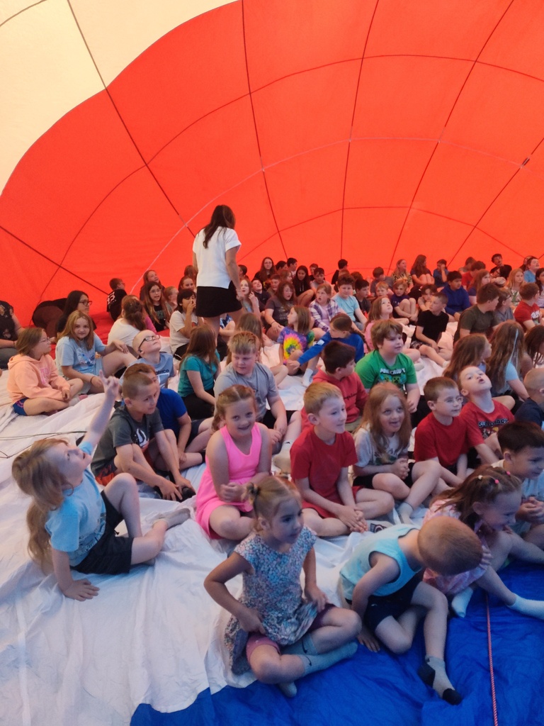 Kid sitting in Remax hot air balloon in Florence Gym