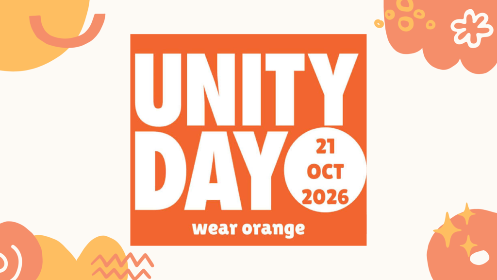 A graphic announcement for Unity Day featuring a large orange square with bold white text that reads "UNITY DAY". Below the title, the text "wear orange" is displayed in white lowercase letters. To the right within the square, a white circle contains the date "21 OCT 2026" written in orange text. The image is framed with abstract shapes in shades of orange, yellow, and peach, along with decorative doodles like flowers and doodles.