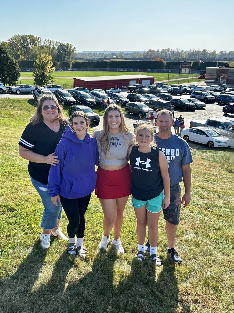 Jen Endres poses with family