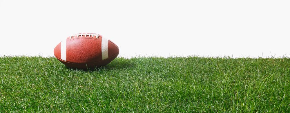 football on the grass with white background