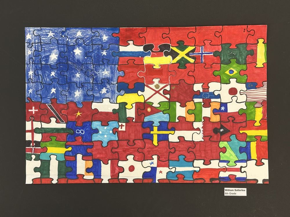 Art project showing American flag comprised of many countries flags as puzzle pieces