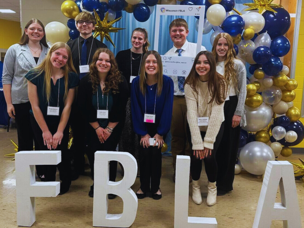 FBLA students pose with balloons at the regional leadership conference