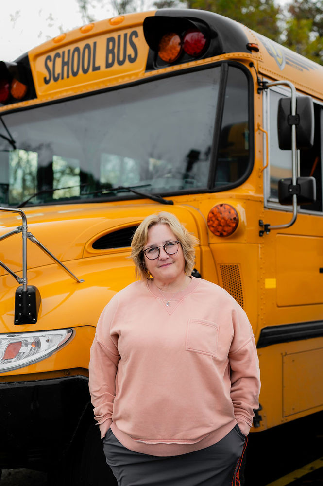 Jill Stekel posed in front in bus