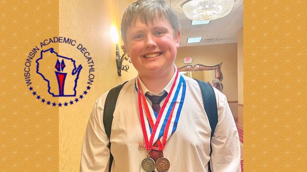 Brett Salisbury poses with medals