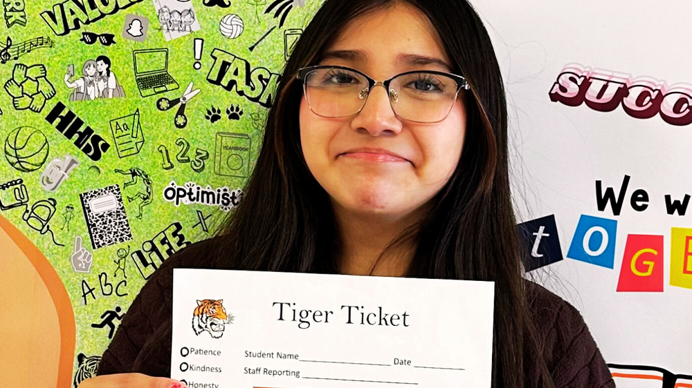 Student poses with Tiger Ticket