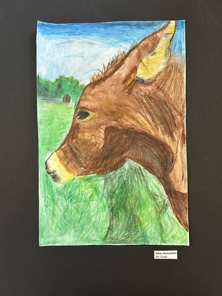 Drawing in full color of a donkey's face, with a small barn in the background.