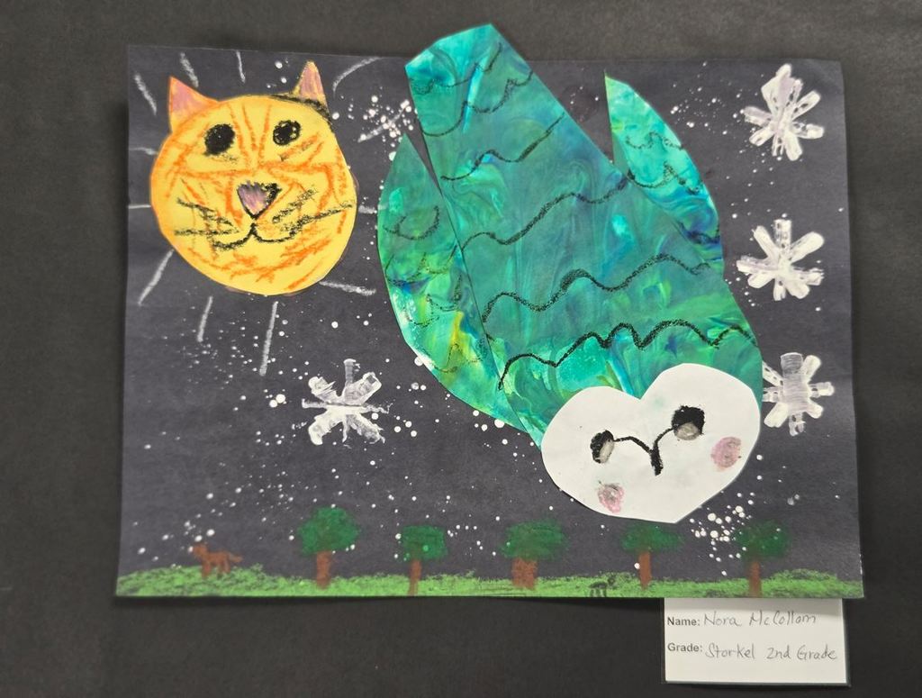 cut paper artwork of owl and moon-cat.