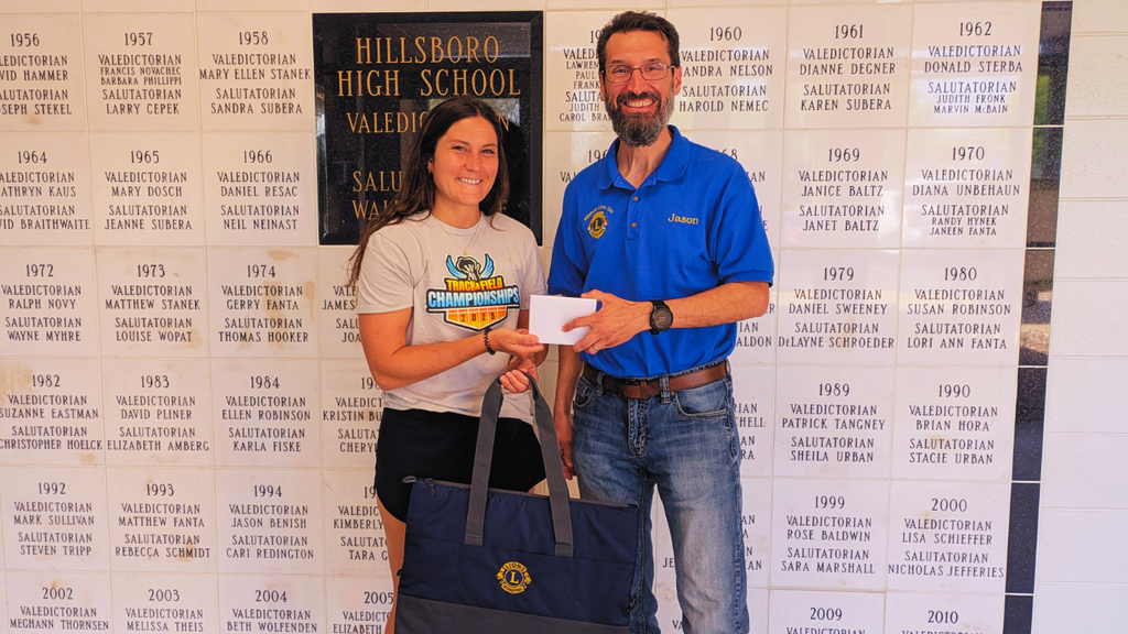 Hilary Stanek and Jason Kirkpatrick pose with cooler donations
