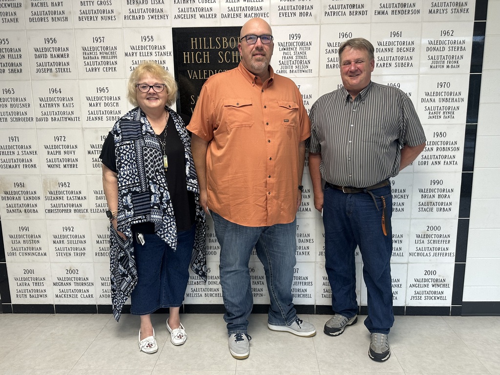 Lori Cherf and Bob Stekel are recognized and pictured with Jason Oetzman, board president.
