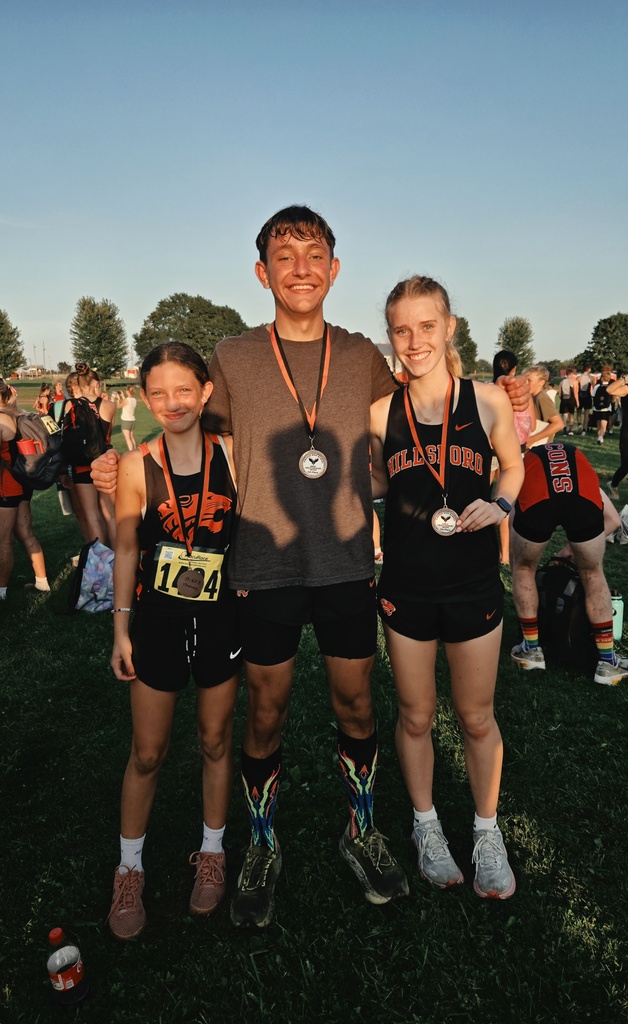 Students pose together with cross country awards.