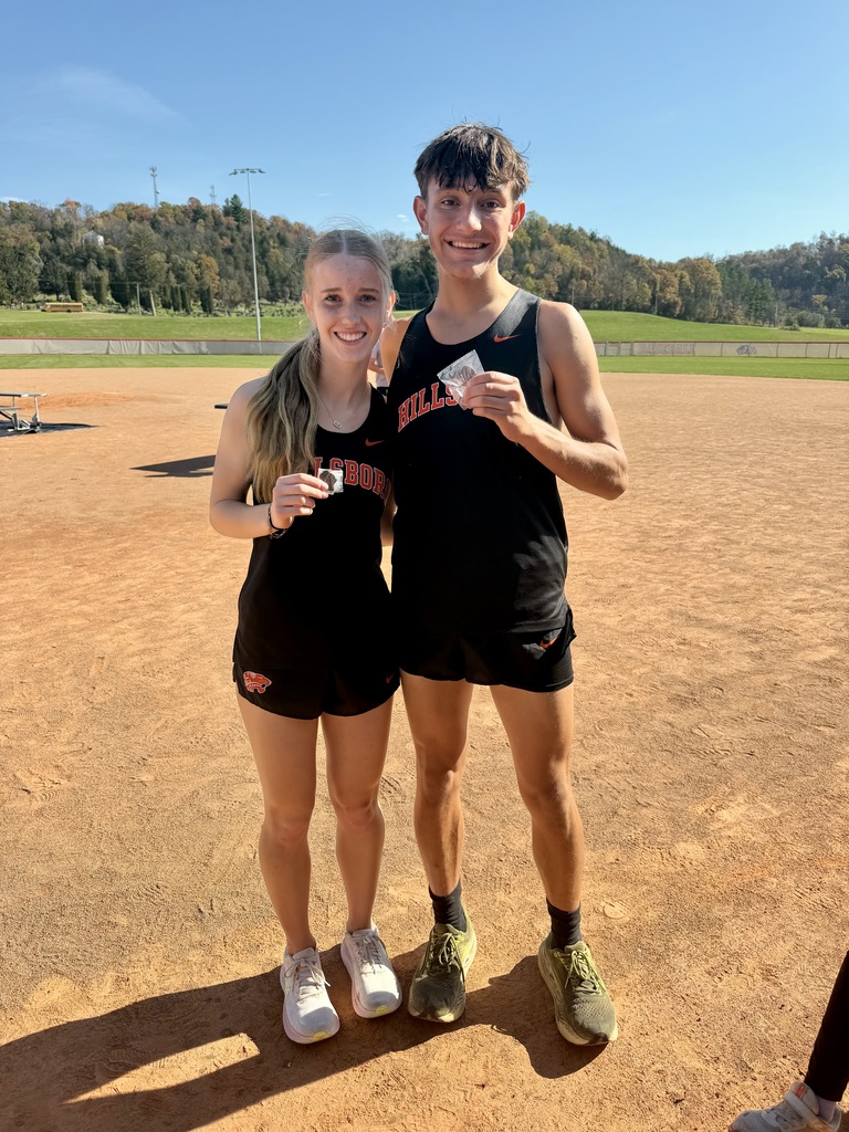 Olivia McCauley and Dominic Kirkpatrick pose as state qualifiers for HS Cross Country
