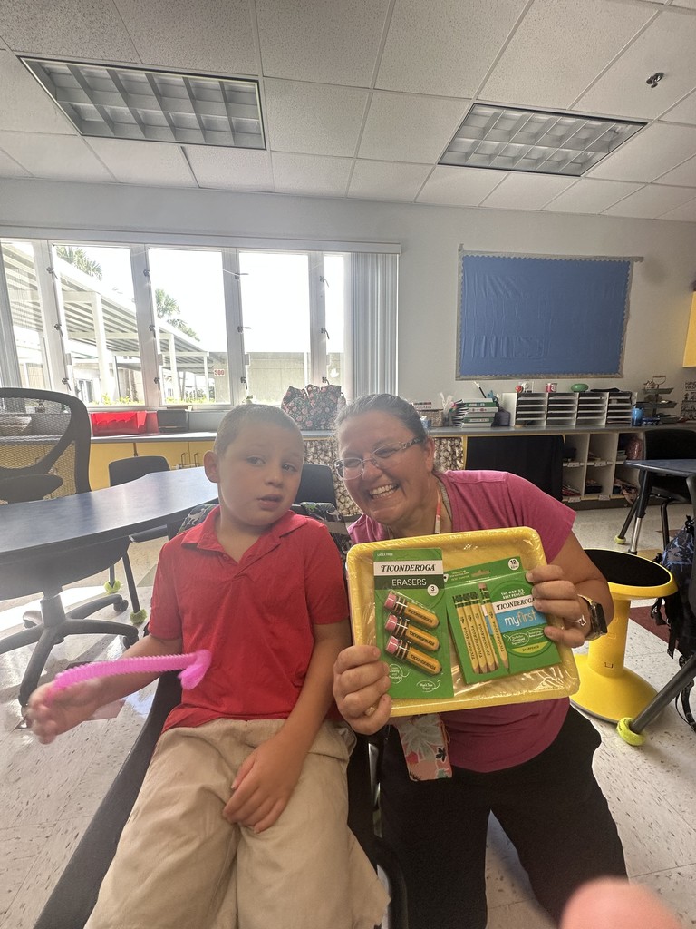 students with teach and school supplies