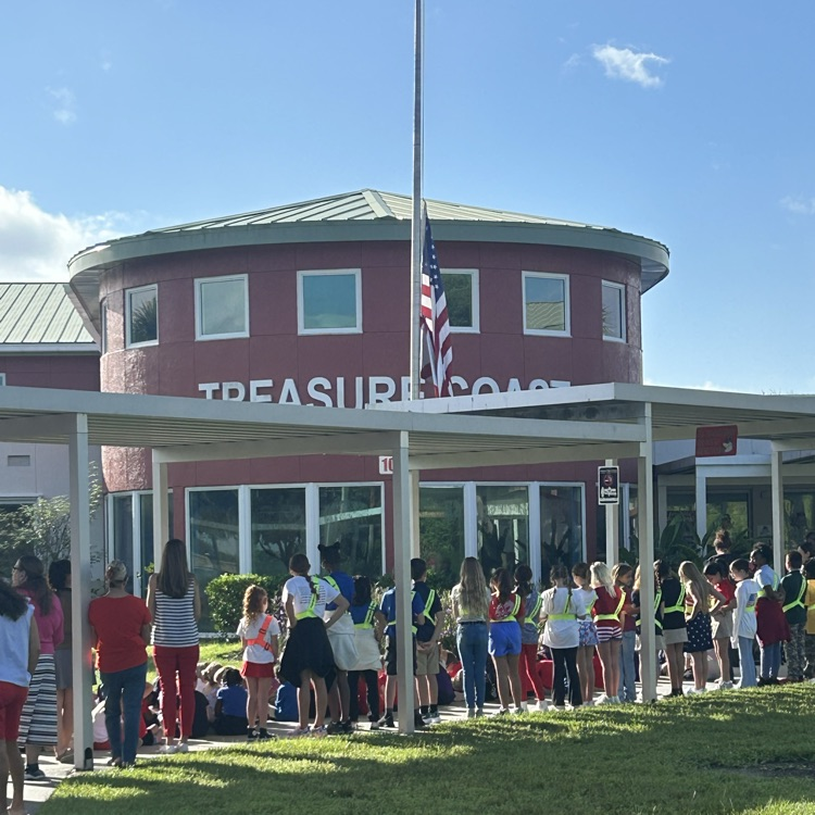 front of school with students