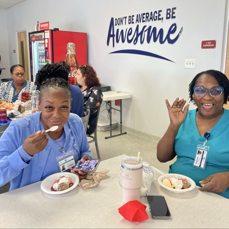 Enjoying their ice cream. 