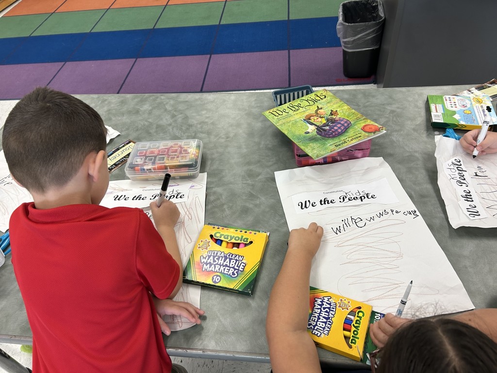 Students working on by reading the book We the Kids by David Catrow and created our own preamble.