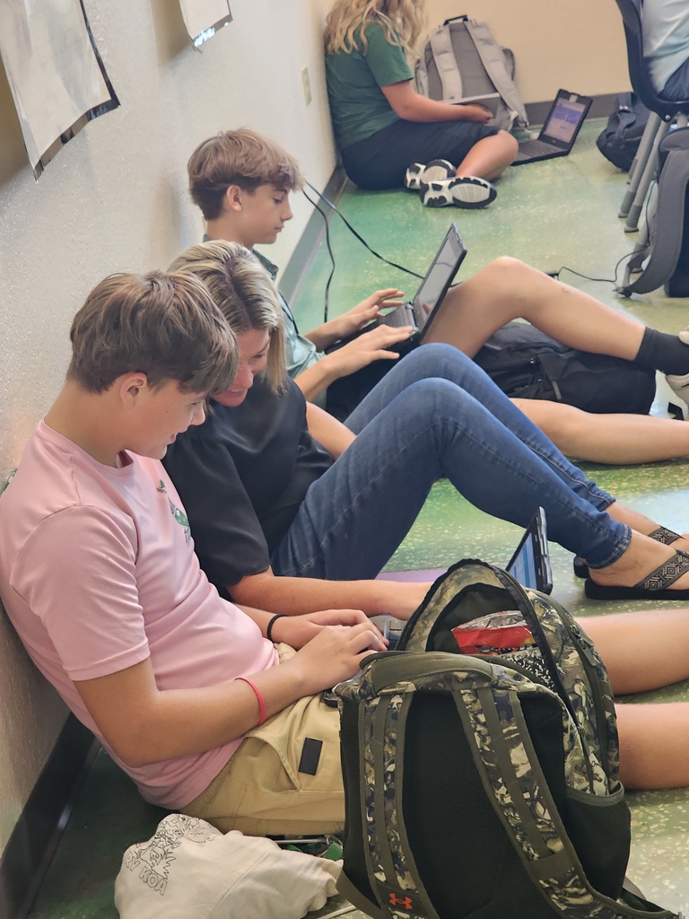 teacher and students on the floor