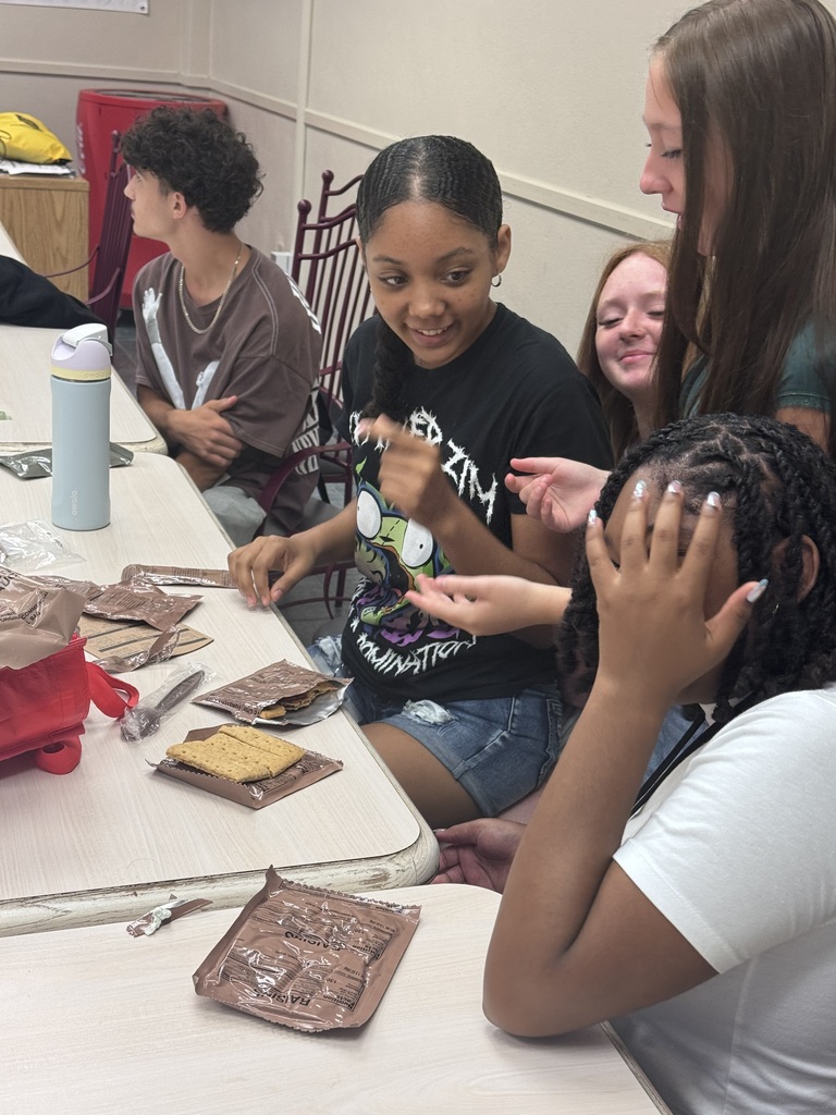 Students in culinary arts trying MREs.