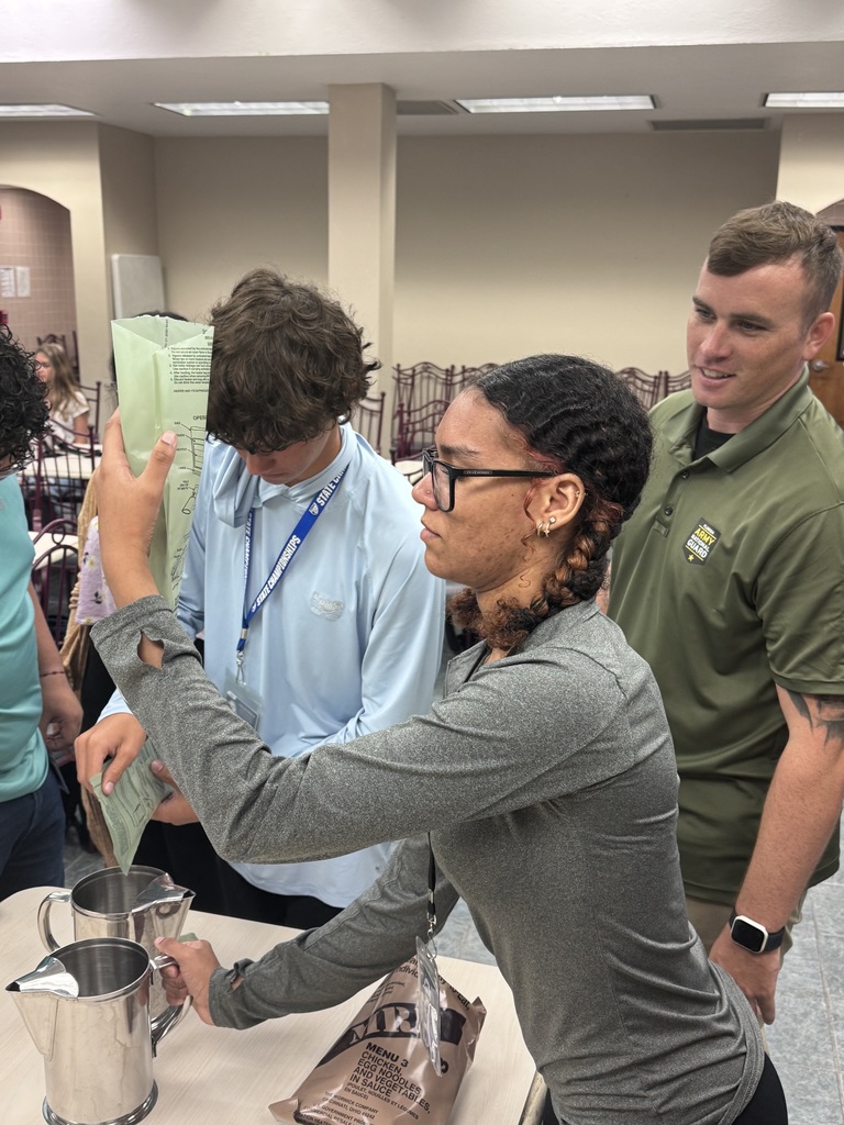 Students in culinary arts trying MREs.