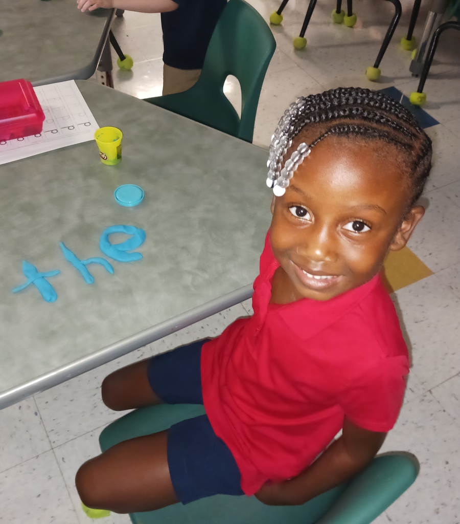 students spelling words with playdoh