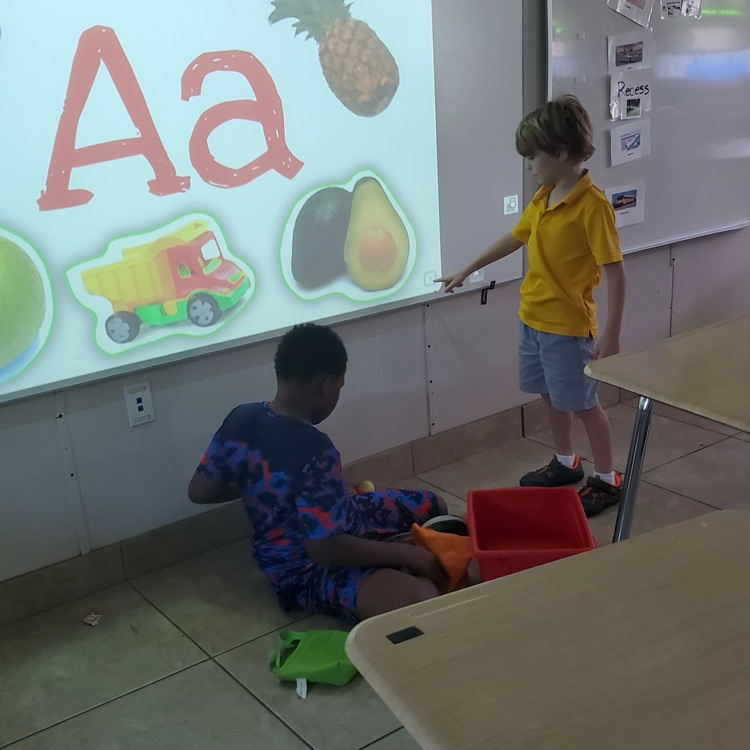 students at the learning board