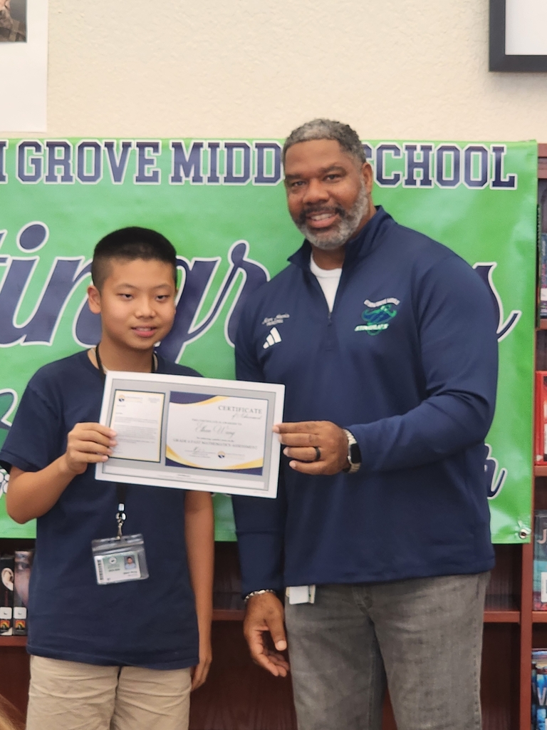 Student and Principal holding award