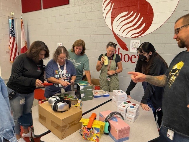 staff with teaching materials