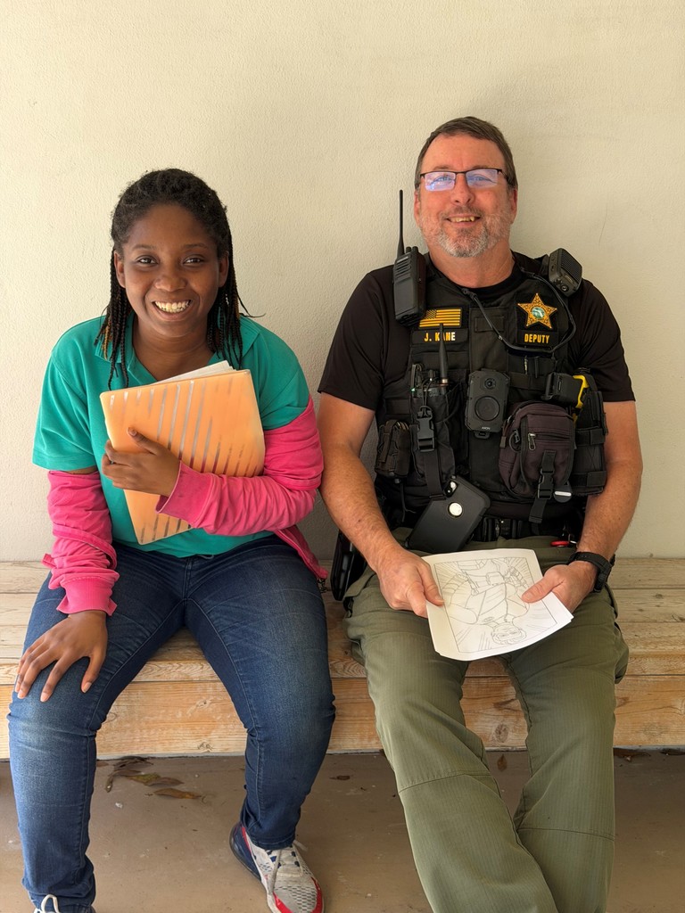 Student with school resource deputy