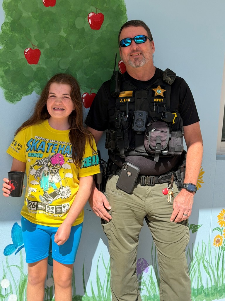 Student with school resource deputy