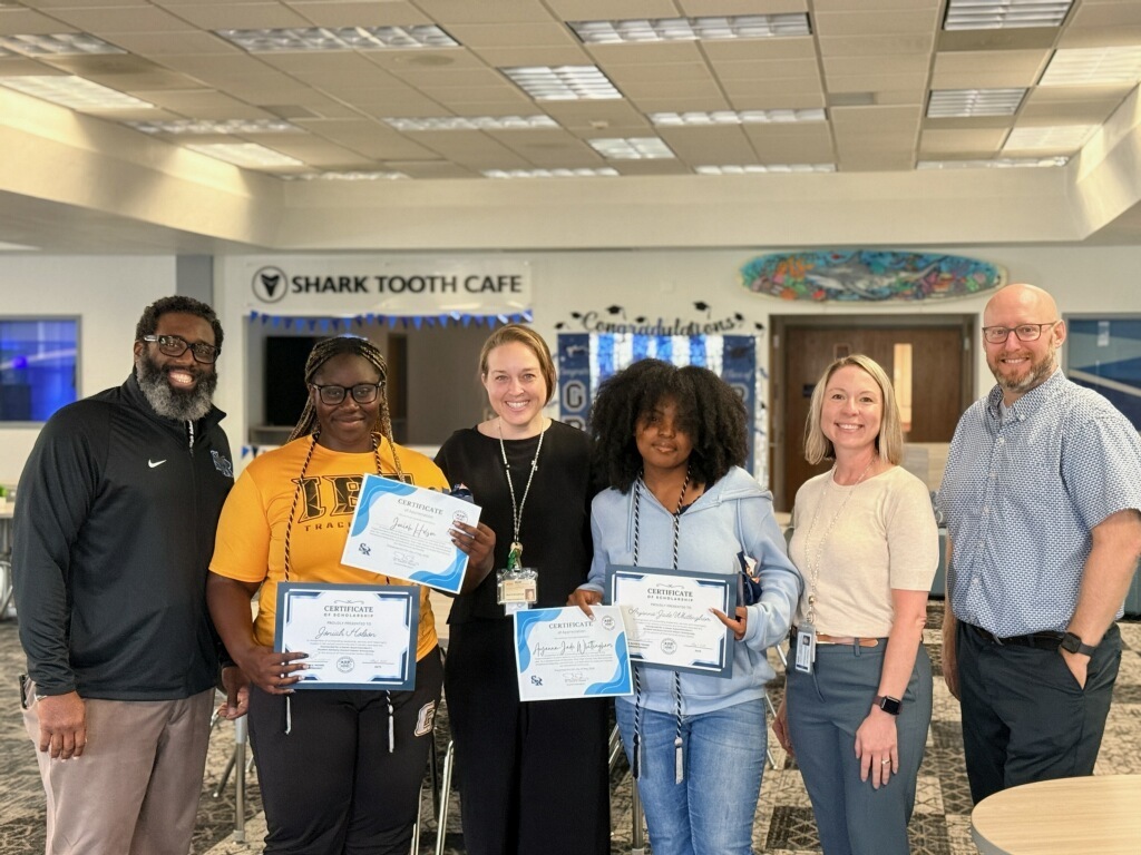 Admin with scholarship recipients