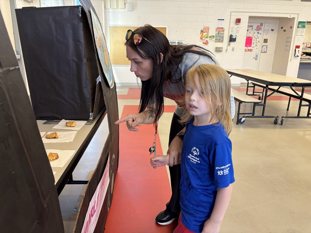 student and teacher visiting the food truck