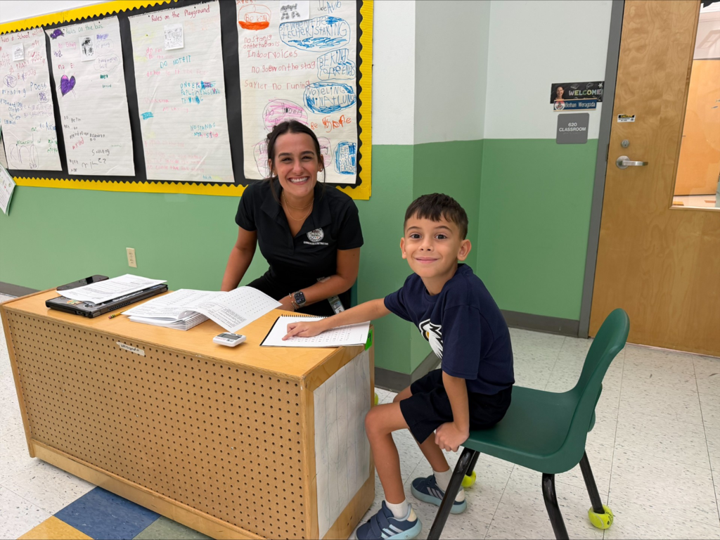 Teacher helping student
