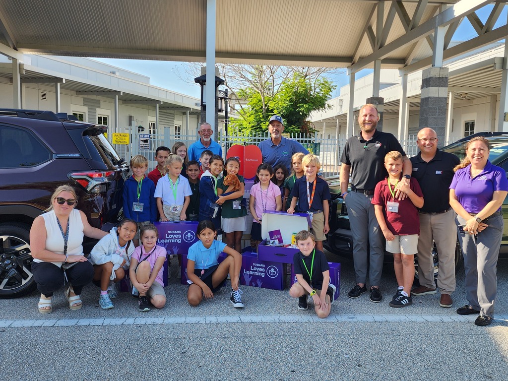 Students and staff accepting donation.