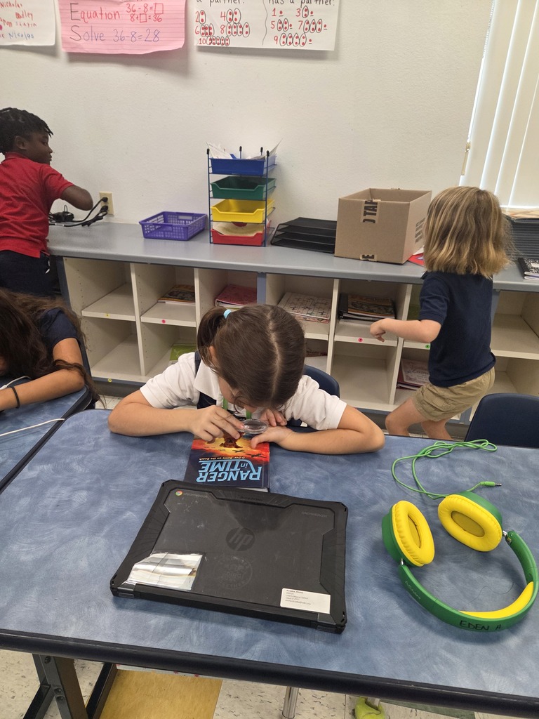 students using magnifying glasses