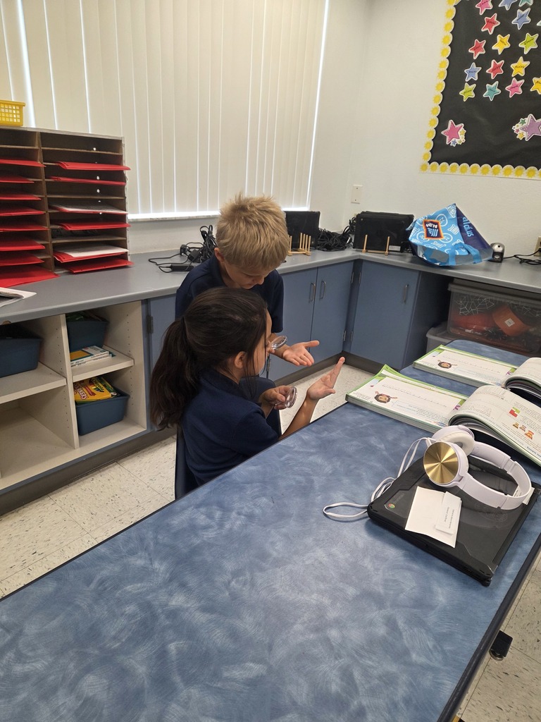 students using magnifying glasses