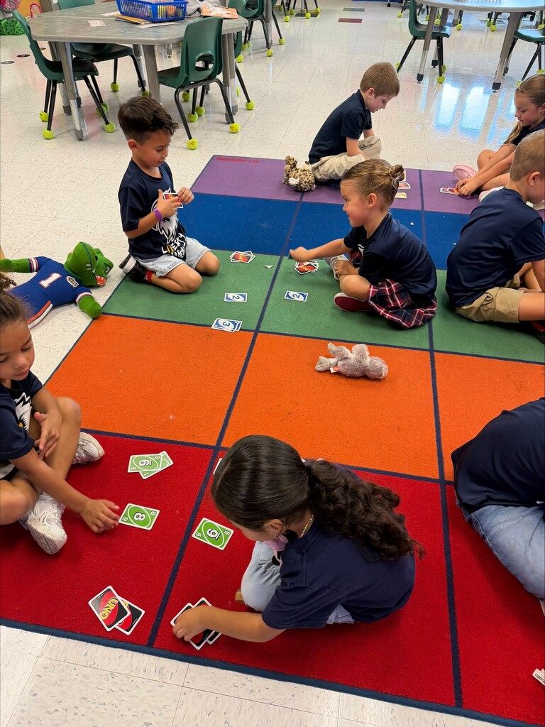 Kids playing with uno cards