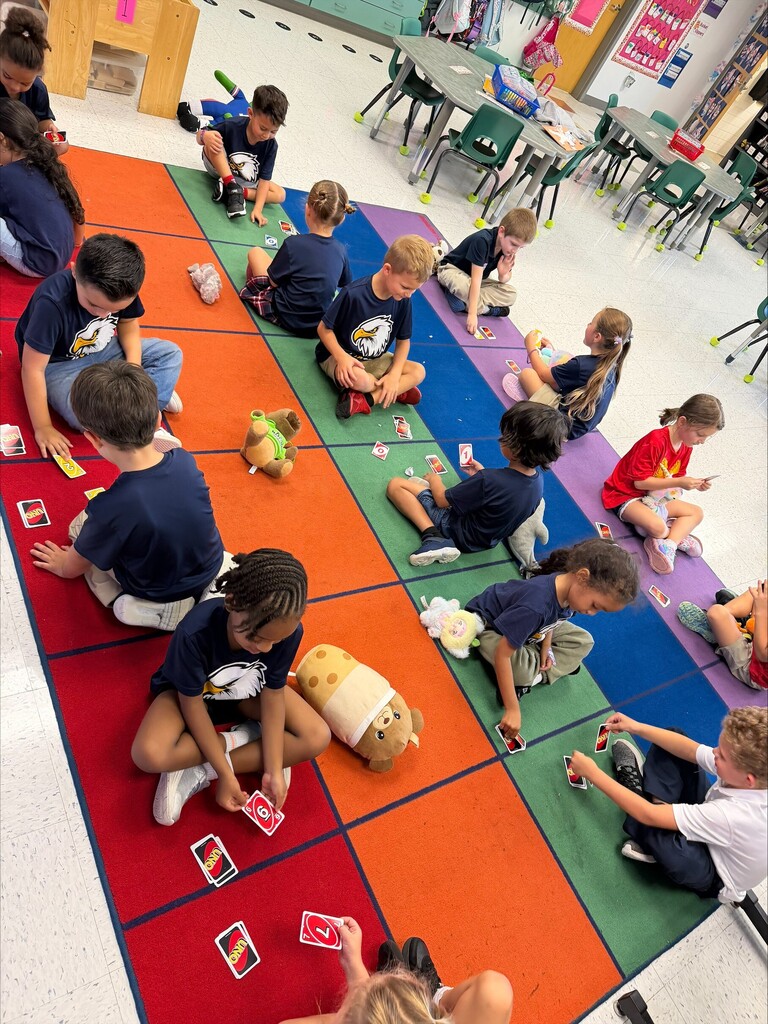 Kids playing with uno cards