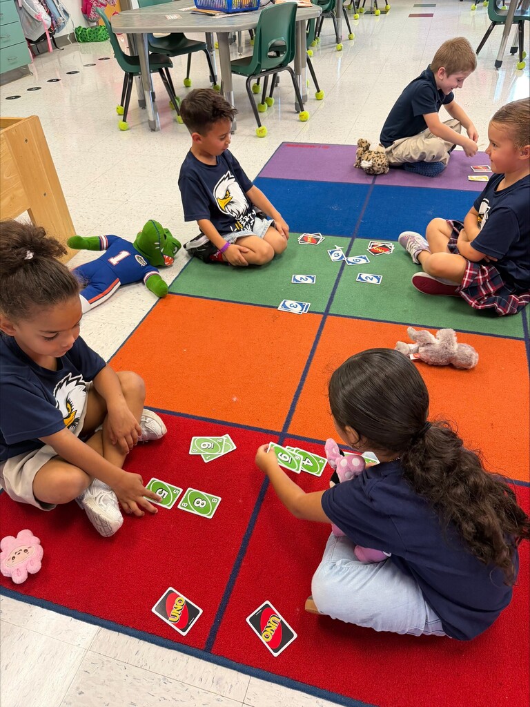 Kids playing with uno cards