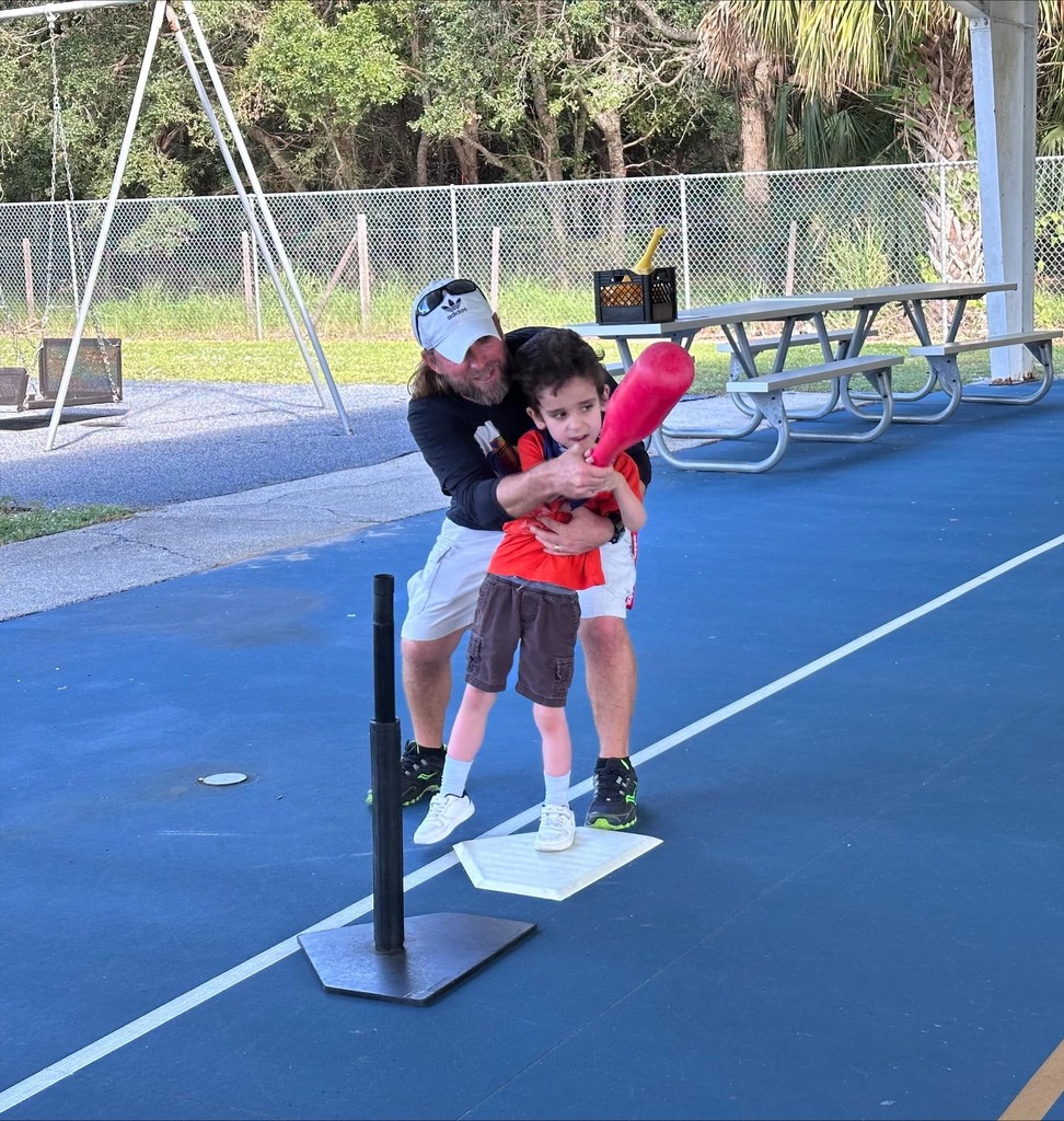 student playing tball
